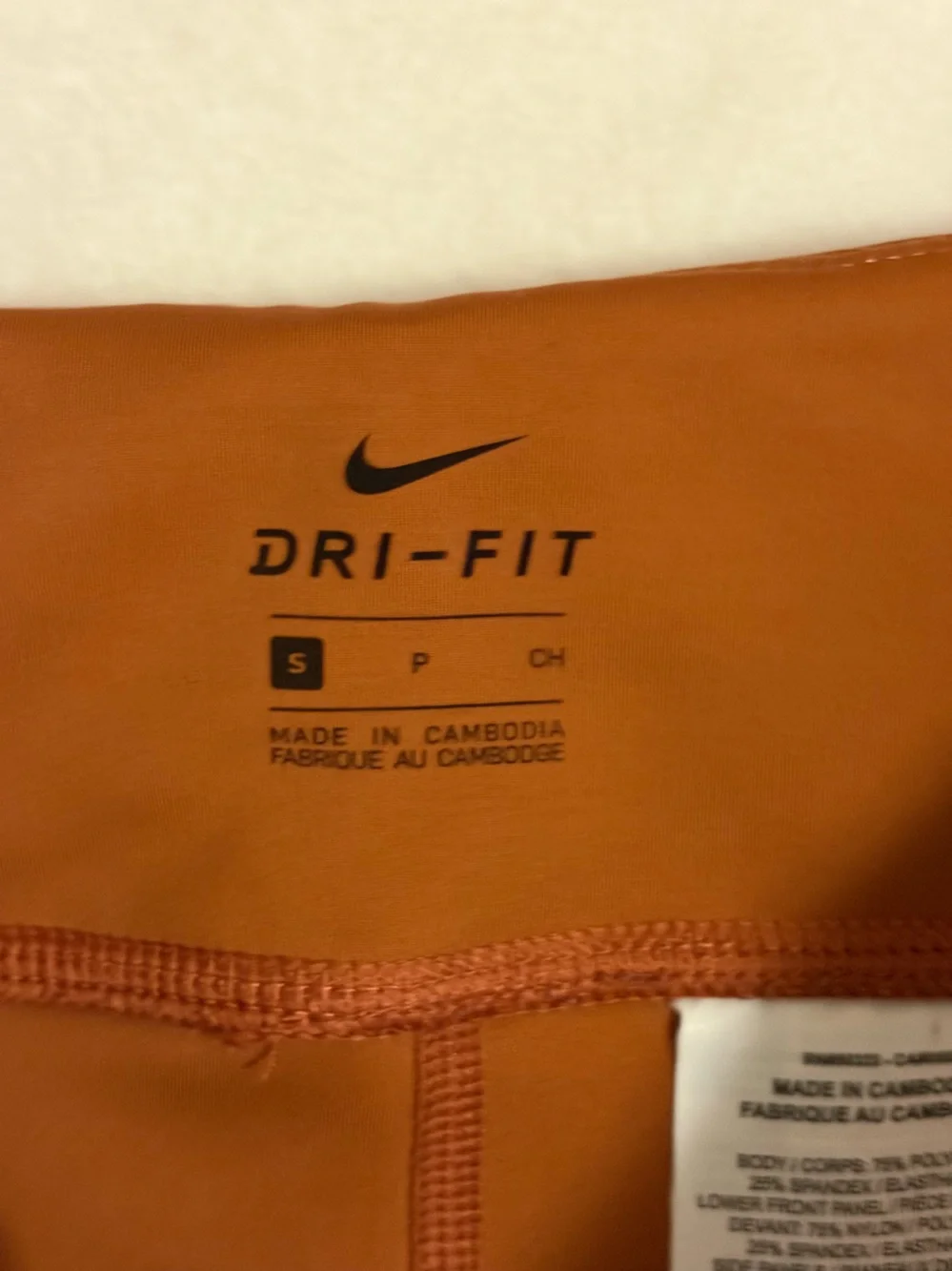 Nike Kids Rust and Peach Colorblock Performance Leggings